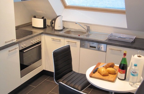 Grossenbrode Apartment | Exclusive penthouse apartment Meeresrauschen 16 in Großenbrode on 2 levels. South-west-facing roof terrace and north-east-facing loggia with magnificent sea views. Seasonal beach chair & additional costs included. With whirlpool