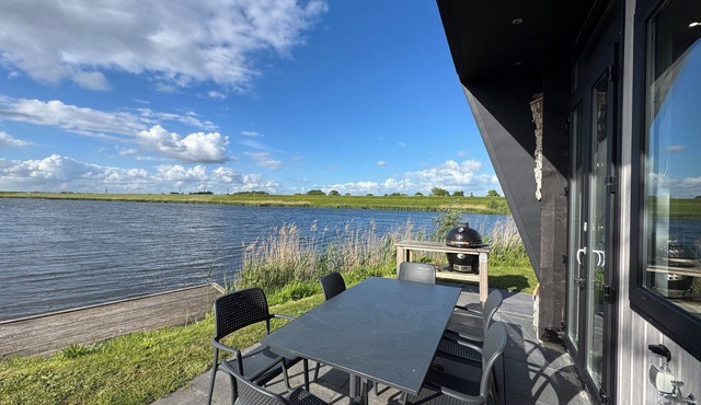 Modern chalet with exceptional lake and river views, private garden and fenced p in Kampen