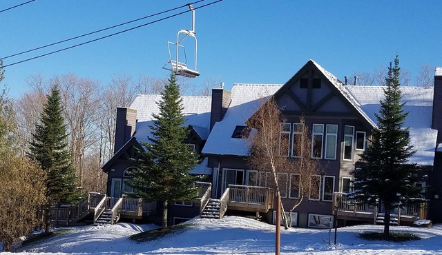 Ski in/out 4 BR townhome directly on Raccoon Run and the Village Chair Lift ! in Jay